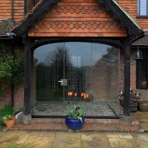 Farnham porch with curved glass