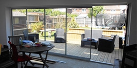 Frameless slide and stack doors in a Weymouth home