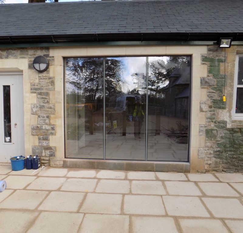 Cardiff frameless doors in stone surround image 1