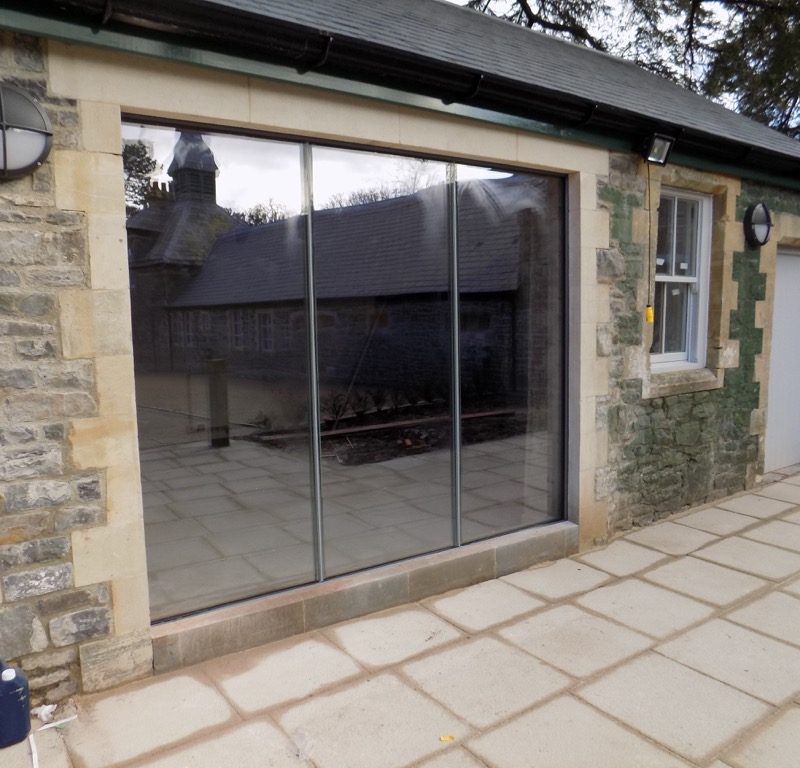 Cardiff frameless doors in stone surround image 11