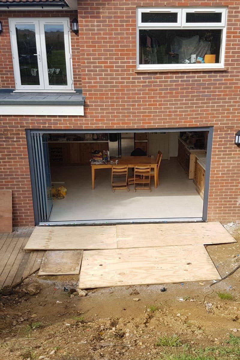 Grey frameless doors to new extension