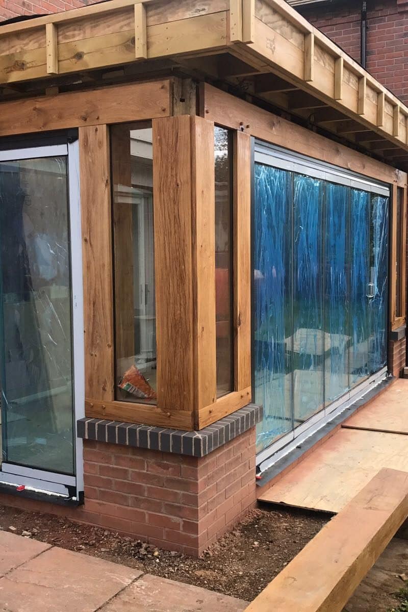 Timber extension with frameless doors