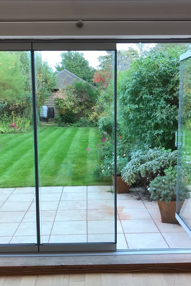 Frameless doors give garden views