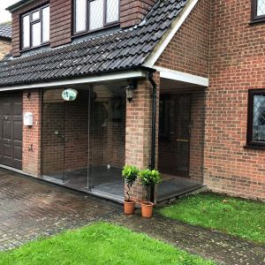 Kent, Frameless porch to a modern house.