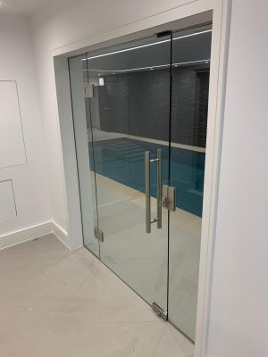 Swimming pool internal glass doors