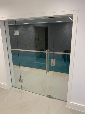 Swimming pool internal glass doors