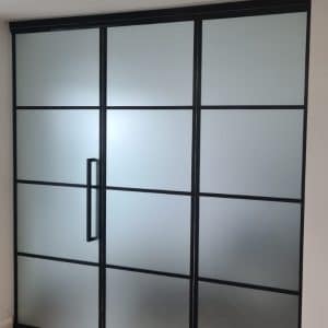 steel-look interior bifolding doors as a room divider