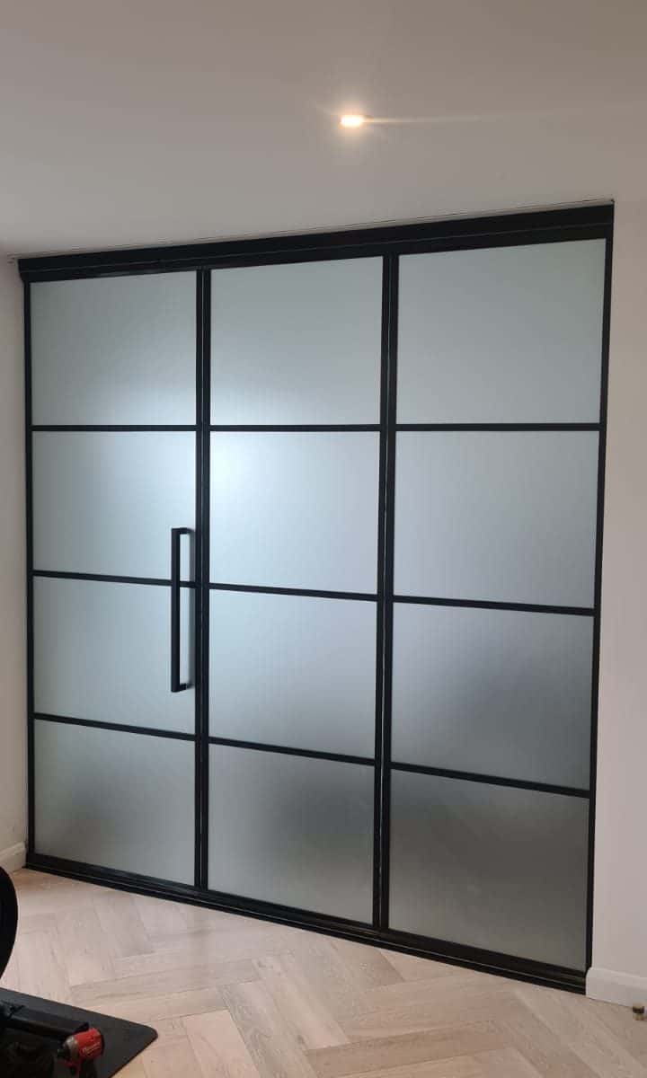 steel-look interior bifolding doors as a room divider