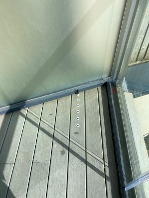 balcony enclosures for apartments showing pins holding open doors in place