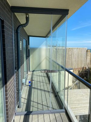 balcony enclosures showing a glass door for access